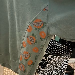 green crew neck with flowers